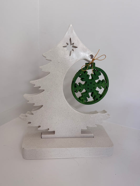 Concrete tree with hanging ornament